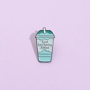 Enamel drink cup brooch with I Just Love Having A Blast text in light blue and green