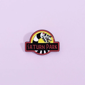 Enamel beetlejuice sandworm pin in jurassic park style saturn park metal badge