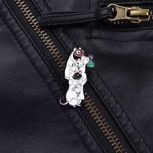 Close-up of laboratory mouse enamel pin on black leather jacket with scientist theme