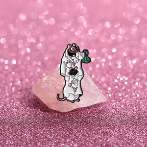 Macro detail of enamel lab rat brooch showing funny mice in a doctor coat with flask