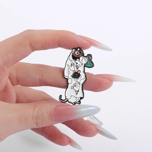 Detail of lab rat enamel pin with cute cartoon mice in lab coat holding a green flask