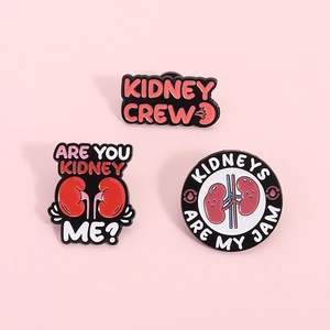 Set of 3 kidney-themed enamel pins featuring Kidney Crew and witty puns on pink background