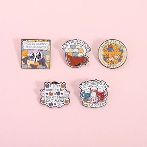 Five-piece cartoon cat enamel pin set with catpuccino and coffee motifs on pink background