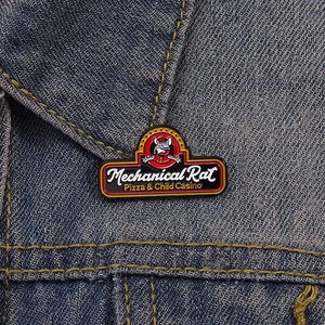 Detailed close-up of Mechanical Rat enamel pin on a denim jacket collar for retro style