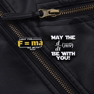 Macro shot of physics formula enamel pins on a leather jacket with golden F=ma engraving