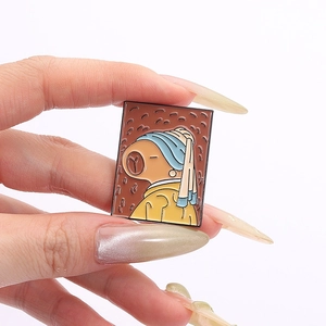 Detailed enamel pin showing a cute Capybara version of the Girl with a Pearl Earring