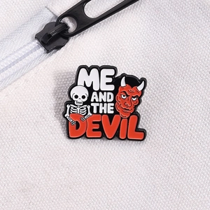 Detailed macro view of Me and the Devil enamel pin on white canvas bag texture