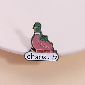 Creative enamel duck brooch pin featuring a green mallard head and chaos text design
