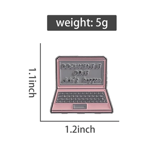 Macro shot of pink laptop enamel pin with Document It engraving and dimension markings