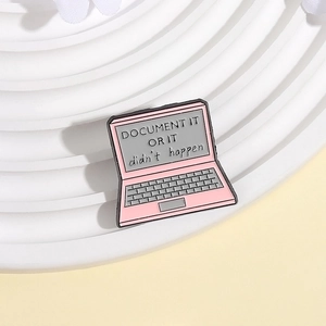 Pink laptop enamel pin featuring DOCUMENT IT OR IT didn't happen text for backpacks