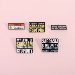 Set of five sarcastic enamel pins featuring witty phrases and minimalist metal designs