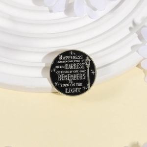 Magic school enamel pin featuring street lamp and inspirational quote on black backdrop