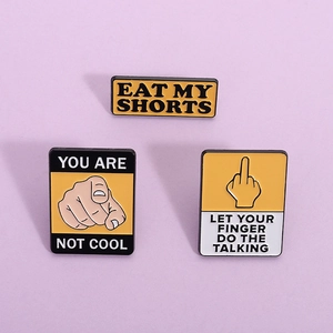 Creative enamel pins with funny English slogans and hand gestures on purple background