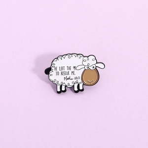 Cartoon sheep enamel pin featuring Matthew 18:12 quote on a lavender background
