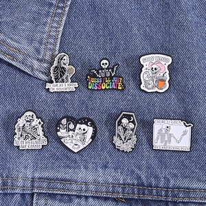 Gothic skull enamel pin set featuring skeleton designs on blue denim jacket