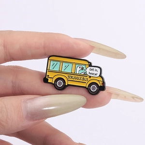 Yellow Struggle Bus enamel pin with white goose driver and Get in Bestie quote