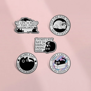 Set of five cartoon cat enamel pins featuring cute kitten designs on a pink background