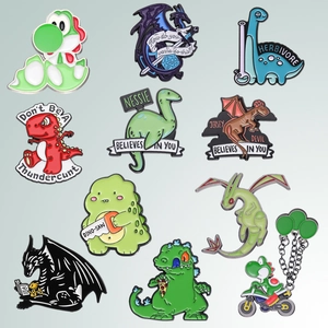 Collection of ten detailed enamel dinosaur and dragon pins in polished zinc alloy