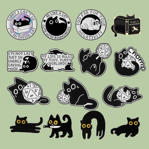 Cute black cat enamel pin set with cartoon liquid cat and D20 dice motifs on green background