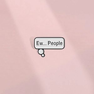 Close-up of a white speech bubble enamel pin with humorous Ew People text on pink background