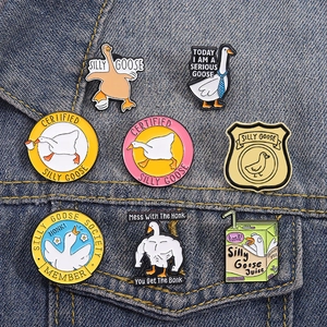 Set of 8 cute funny goose enamel pins with cartoon quotes on a denim jacket background