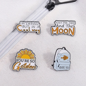 Funny cartoon quote enamel pin set on white canvas bag with yellow sun and fish designs
