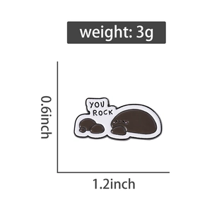 Technical drawing showing dimensions and 3g weight of the grey You Rock stone enamel pin