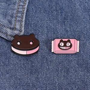 Cute cartoon black cat enamel pins set for bags and clothes on blue denim fabric
