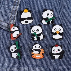 Set of eight cute cartoon panda enamel pins in various poses on denim background