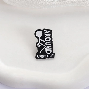 Creative stickman enamel pin with Around and Find Out text in black and white finish