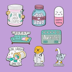 Vue détaillée de huit épinglettes en émail sur la santé mentale avec flacons et docteurs