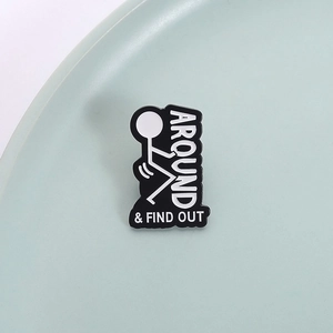 Funny matchstick figure enamel pin with Around & Find Out text in black and white finish