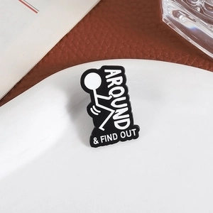 Funny stickman enamel pin with Around and Find Out text on a ceramic plate