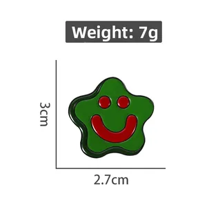 Detailed view of green star smiley face enamel pin with 3cm x 2.7cm size dimensions