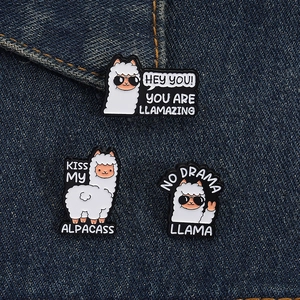 Three funny cartoon llama enamel pins with humorous puns on a dark denim jacket background