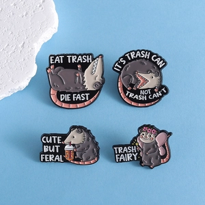 Set of 4 cute opossum enamel pins with humorous quotes on light blue background
