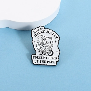 Detailed close-up of cartoon cat riding a tricycle enamel pin on a white cloud display stand