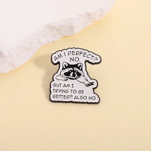 Funny cartoon raccoon enamel pin with creative quote on a minimalist stone background