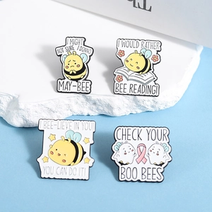 Set of four cartoon honey bee enamel pins with punny slogans on a blue background