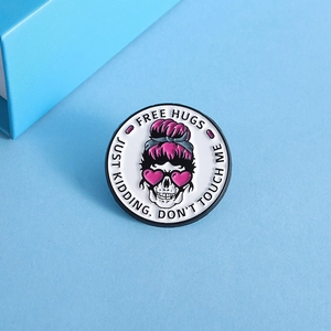 Detail of round enamel skeleton badge featuring humorous English inspirational quotes