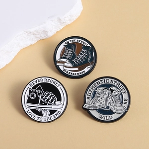 Set of three vintage canvas shoe enamel pins with street style slogans on round badges