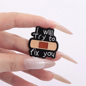 Coldplay band tribute enamel pin featuring fix you text and heart bandage design