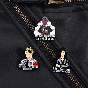 Detailed view of Brooklyn Nine-Nine enamel pins displayed on a black leather jacket
