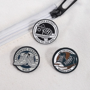 Detailed close-up of retro canvas shoe enamel pins with street style slogans on canvas