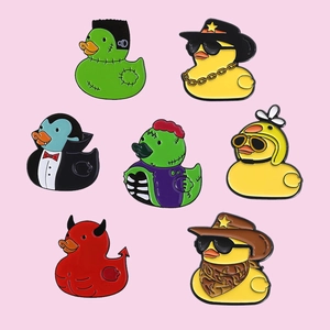 Set of 7 creative duck enamel pins featuring Frankenstein, Dracula, and cowboy themes