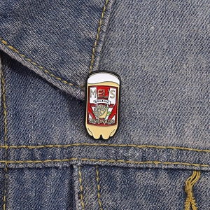 Detailed view of the organic lemonade soda can enamel pin on a denim jacket collar