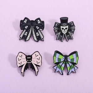 Gothic Halloween enamel pin set featuring skull, ghost, and bat bow designs for accessories