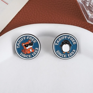 Fashionable round metal badges featuring red panda and penguin with Tariff-Free text