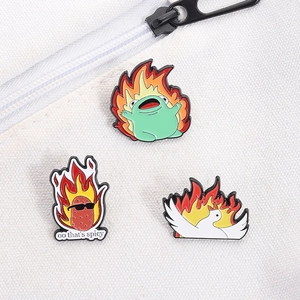 Funny enamel pin set featuring a spicy potato, frog, and goose on a white canvas bag