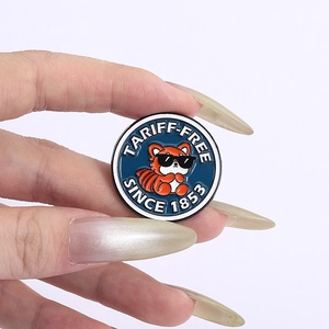 Creative enamel pin featuring a cartoon red panda in sunglasses with text TARIFF-FREE 1853